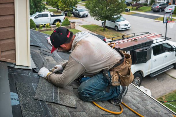 Professional Roof Replacement technician working in Bryant, IN